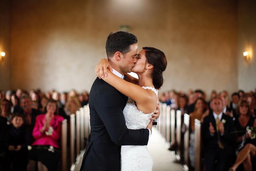 Newlyweds embracing after their ceremony