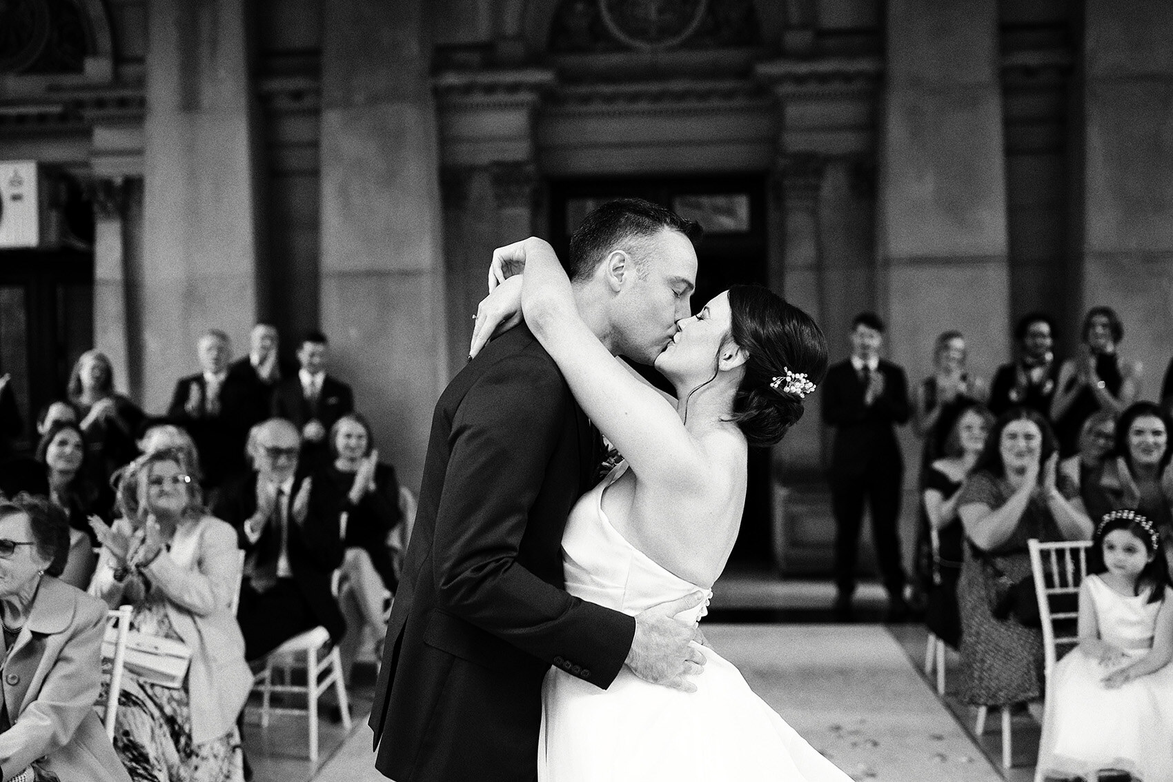 Newlyweds kissing at the end of their ceremony