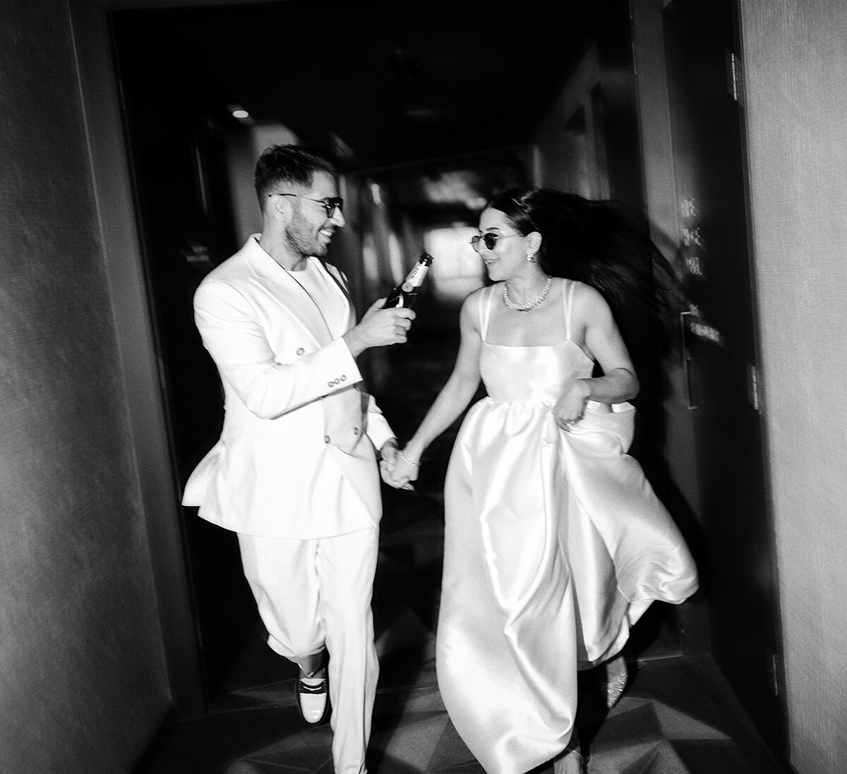 Newlyweds running and laughing