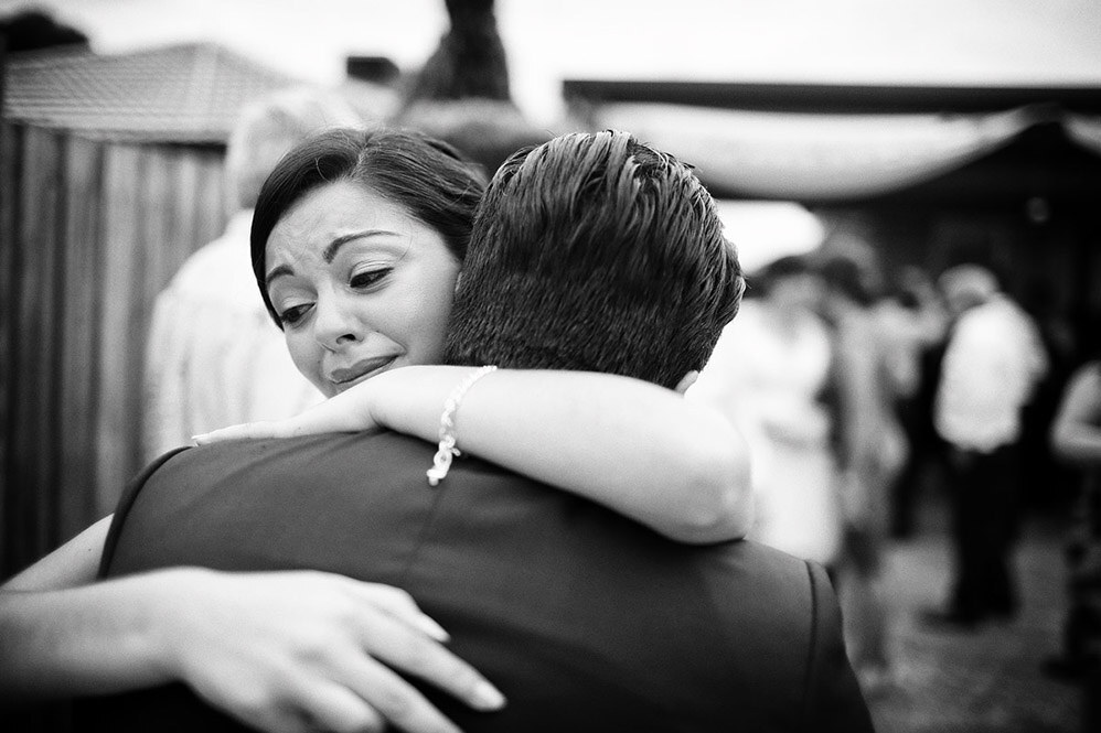 An emotional embrace at a wedding