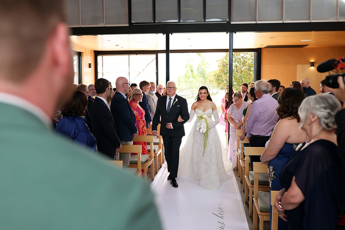 A ceremony moment from Kylie & Sam's wedding at Zonzo Estate