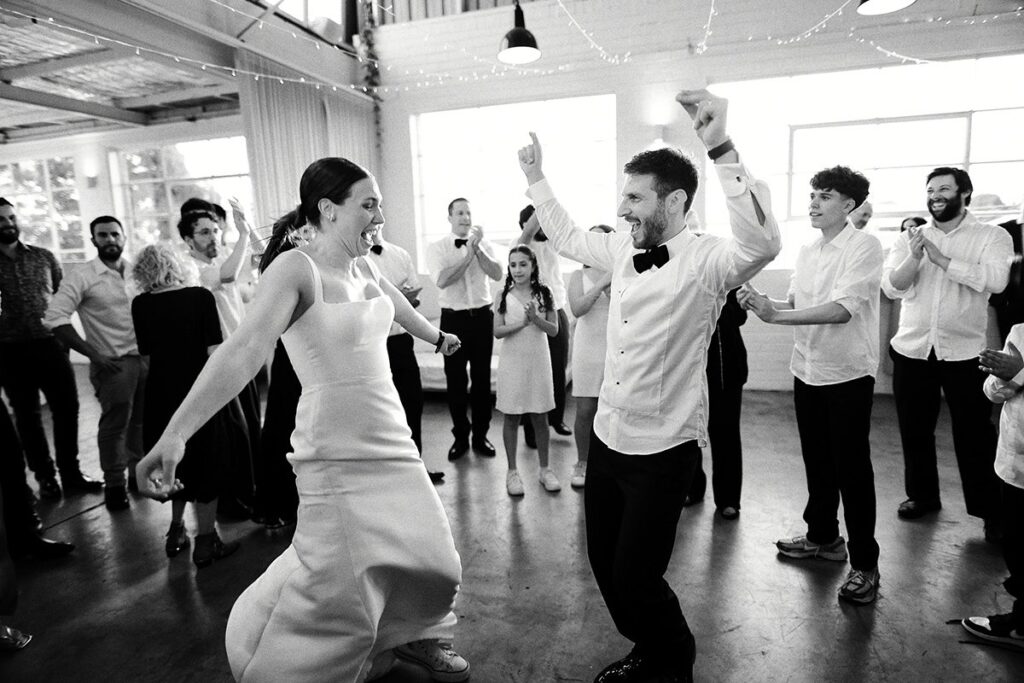 Hora Dance with Georgia & Josh in the defining frame of their wedding at The Button Factory