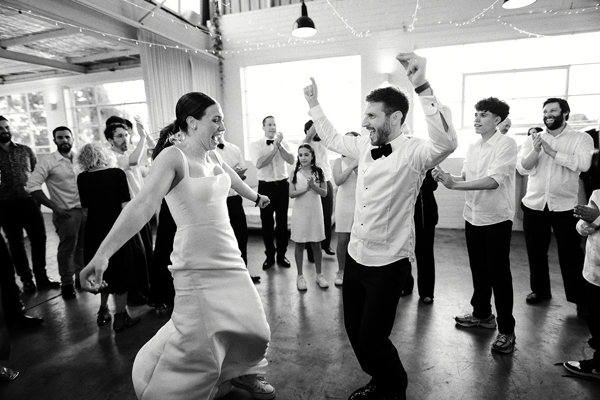 Hora Dance with Georgia & Josh in the defining frame of their wedding at The Button Factory