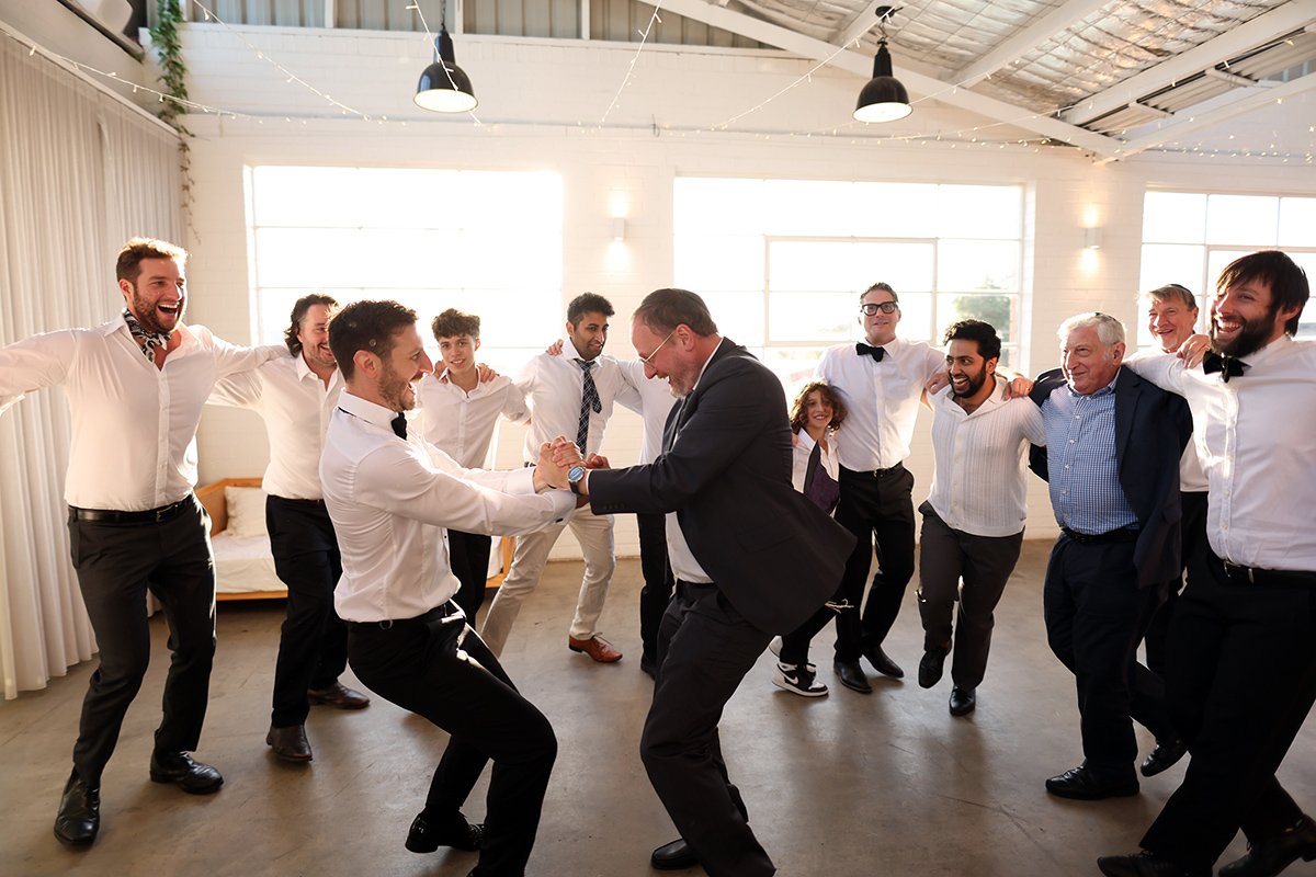 A moment from Hora Dance with Georgia & Josh's wedding story at The Button Factory, story image 4