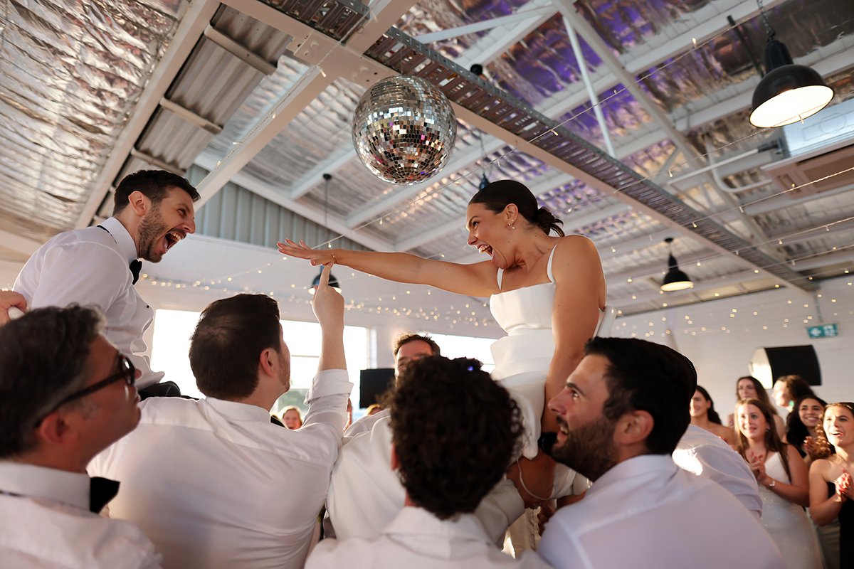 A moment from Hora Dance with Georgia & Josh's wedding story at The Button Factory, story image 6